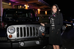 FORT BELVOIR, VA - FEBRUARY 6: Actress Olivia Munn poses for a picture with the Jeep Wrangler Freedom Edition at the launch event for Jeep Operation Safe Return at the USO Warrior & Family Center on February 6, 2013 in Fort Belvoir, VA. (Photo by Brendan Hoffman/Getty Images for Jeep)