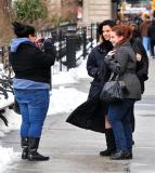 #6595309 Olivia Munn poses with a fan as she takes a break from filming "I Don't Know How She Does It" in NYC, NY on January 21, 2011. Fame Pictures, Inc - Santa Monica, CA, USA - +1 (310) 395-0500