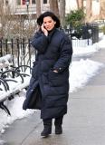 #6595313 Olivia Munn poses with a fan as she takes a break from filming "I Don't Know How She Does It" in NYC, NY on January 21, 2011. Fame Pictures, Inc - Santa Monica, CA, USA - +1 (310) 395-0500