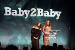 WEST HOLLYWOOD, CALIFORNIA - NOVEMBER 08: (L-R) Olivia Munn and Kerry Washington speak onstage during the 2025 Baby2Baby Gala Presented By Paul Mitchell at Pacific Design Center on November 08, 2025 in West Hollywood, California. (Photo by Emma McIntyre/Getty Images for Baby2Baby)