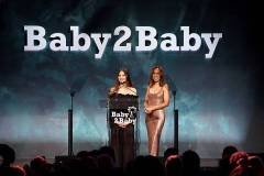 WEST HOLLYWOOD, CALIFORNIA - NOVEMBER 08: (L-R) Olivia Munn and Kerry Washington speak onstage during the 2025 Baby2Baby Gala Presented By Paul Mitchell at Pacific Design Center on November 08, 2025 in West Hollywood, California. (Photo by Araya Doheny/Getty Images for Baby2Baby)