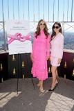 NEW YORK, NEW YORK - OCTOBER 01: (L-R) Elizabeth Hurley and Olivia Munn light the Empire State Building pink with a scrolling ribbon in the mast to honor the Este? Lauder companies' Breast Cancer Campaign and Breast Cancer Awareness Month on October 01, 2025 in New York City. (Photo by John Nacion/Getty Images for Empire State Realty Trust)