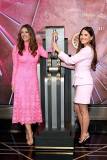 NEW YORK, NEW YORK - OCTOBER 01: (L-R) Elizabeth Hurley, Global Ambassador, The Est?e Lauder Companies? Breast Cancer Campaign, and Olivia Munn light the Empire State Building pink in honor of The Est?e Lauder Companies' Breast Cancer Campaign on October 01, 2025 in New York City. (Photo by Kevin Mazur/Getty Images for The Est?e Lauder Companies)