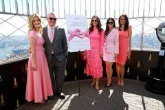 NEW YORK, NEW YORK - OCTOBER 01: (L-R) Mary Alice Haney, William P. Lauder, Executive Chairman, The Est?e Lauder Companies Inc., Elizabeth Hurley, Global Ambassador, The Est?e Lauder Companies? Breast Cancer Campaign, Olivia Munn and Tha?s Aliabadi light the Empire State Building pink in honor of The Est?e Lauder Companies' Breast Cancer Campaign on October 01, 2025 in New York City. (Photo by Kevin Mazur/Getty Images for The Est?e Lauder Companies)