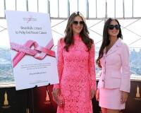 NEW YORK, NEW YORK - OCTOBER 01: (L-R) Elizabeth Hurley, Global Ambassador, The Est?e Lauder Companies? Breast Cancer Campaign, and Olivia Munn light the Empire State Building pink in honor of The Est?e Lauder Companies' Breast Cancer Campaign on October 01, 2025 in New York City. (Photo by Kevin Mazur/Getty Images for The Est?e Lauder Companies)